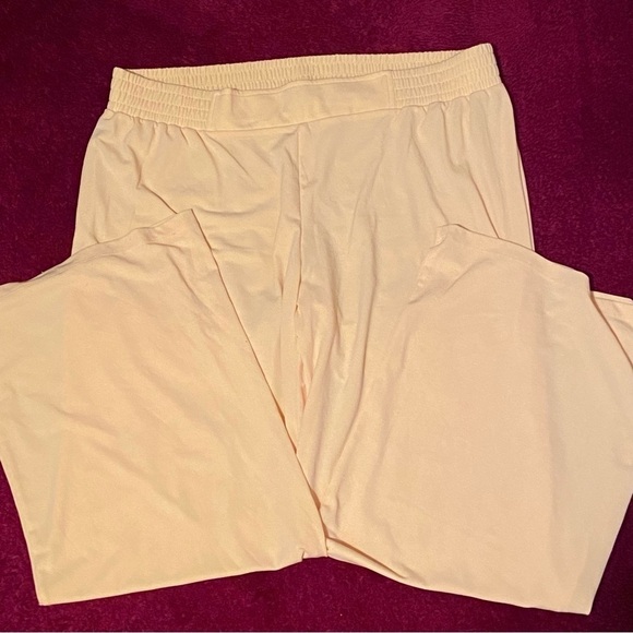 IMAN slacks in canary yellow with elastic waist and room in the boot. Soft sexy. - Picture 3 of 6